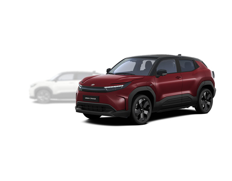 Roter Toyota Urban Cruiser Lounge in seitlicher Sicht, im Hintergrund ist ein verblasster heller Toyota Urban Cruiser Lounge mit Allradantrieb zu erkennen